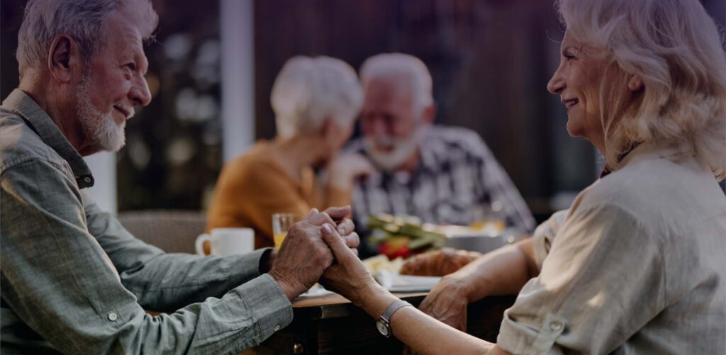 senior couples talking at dinner
