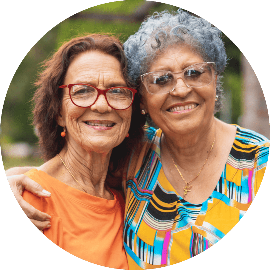 senior women embracing within the Copeland Tower Living community
