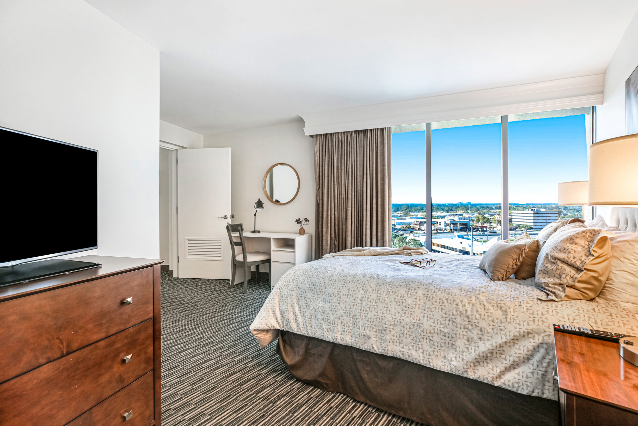 Copeland Tower Living senior apartment bedroom with view of New Orleans skyline